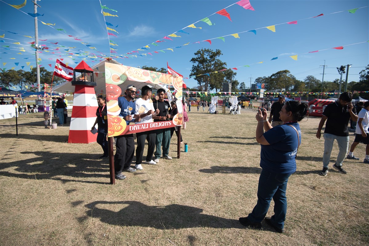 Visitors posing at the Diwali photo booth