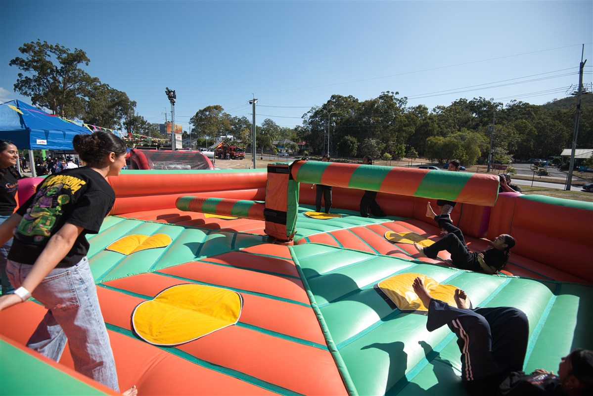 Children on an inflatable wipeout ride